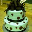 2 tiered with brown ribbon, polka dots and brown fondant bow